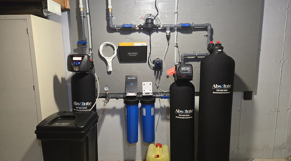 Compact Deluxe side-by-side water filter and softener unit installed in a Port Stanley Ontario residence