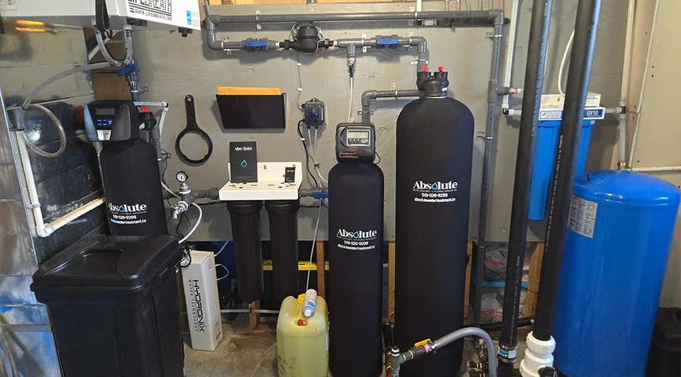 Compact Deluxe side-by-side water filter and softener unit installed in a Port Stanley Ontario residence