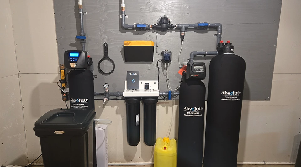 Compact Deluxe side-by-side water filter and softener unit installed in a Port Stanley Ontario residence